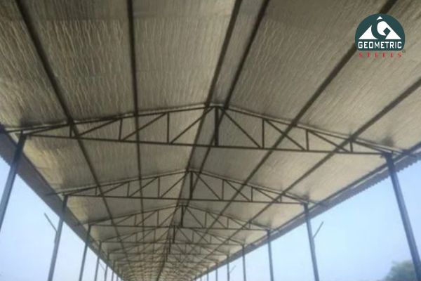 Insulated metal roofing sheet